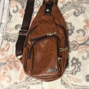 Small crossbody bag with adjustable strap.